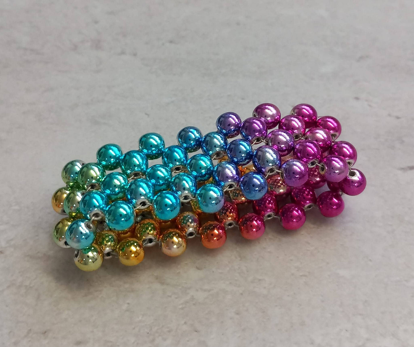 Penisring Masturbator 75 rotierende irisierende Regenbogen Hämatit - Perlen auf Chirurgenstahl Innen - Umfang ca 11,6cm - SEXSENSE